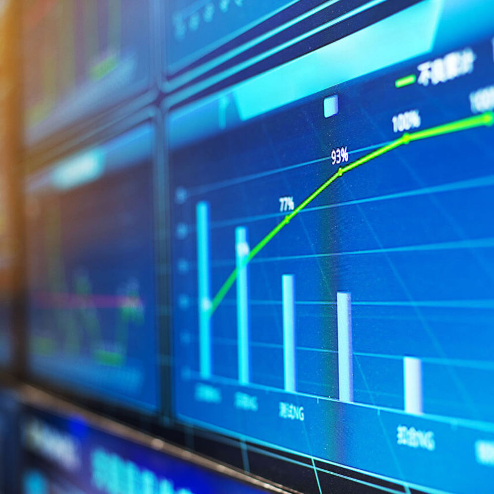 Computer screens with graphs and charts.