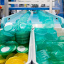 Mass Production Of green and yellow Plastic Lids And Containers
